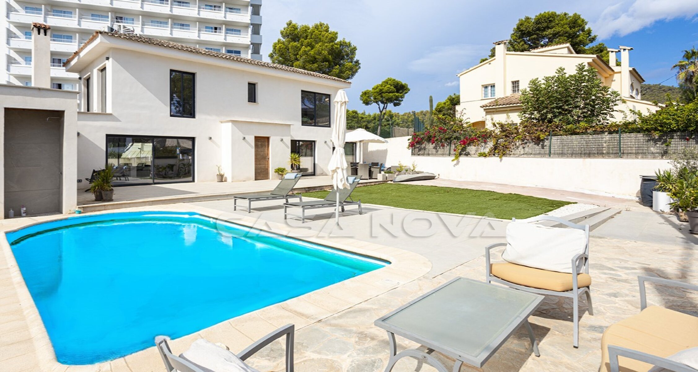 Modern villa with pool near the sandy beach